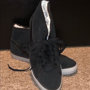 Black Nike high top sneakers with fur lining.